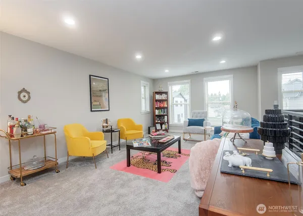 a living room with furniture and a large window