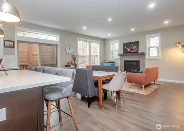 a living room with furniture a fireplace and a table