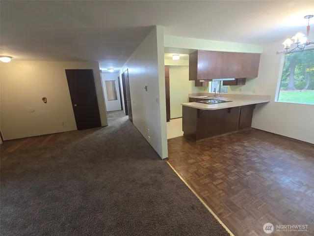 a kitchen with refrigerator and window