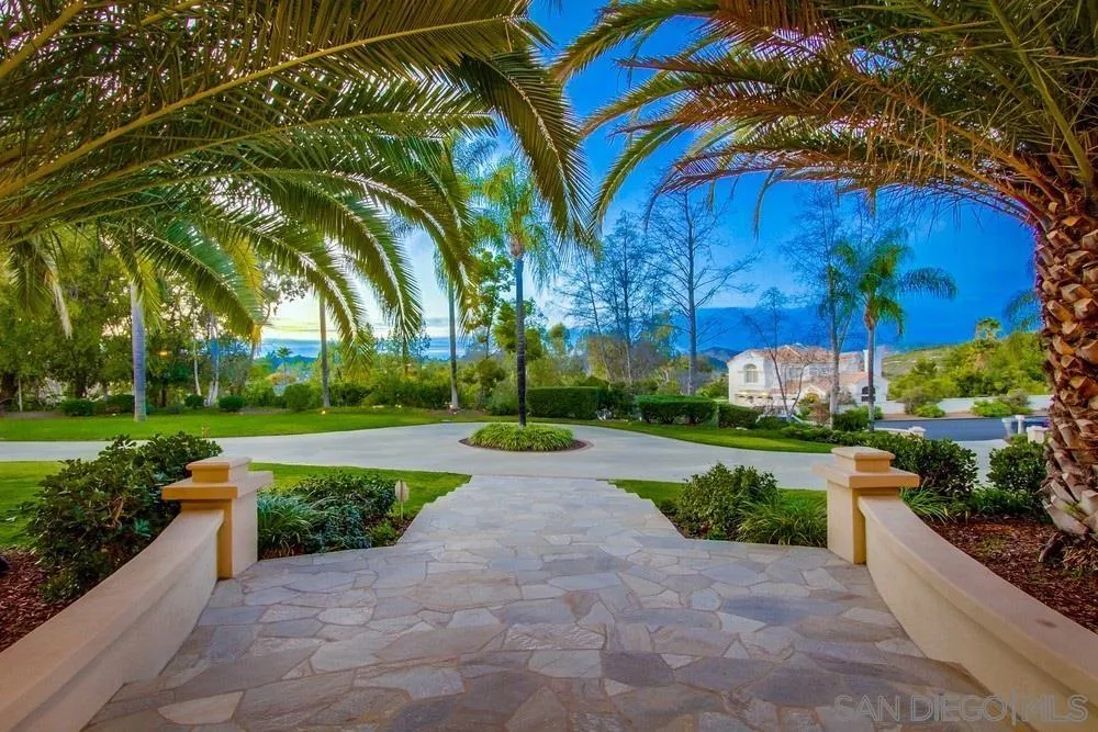 16348 Country Day Road Poway, CA 92064 - Photo 1 of 38 a view of a garden with a bench