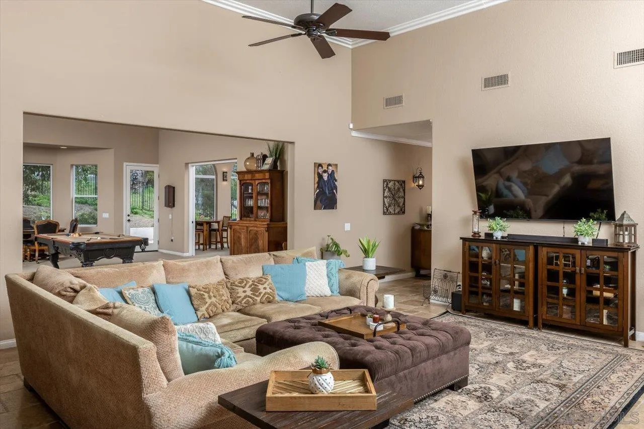 16348 Country Day Road Poway, CA 92064 - Photo 11 of 38 a living room with furniture and a flat screen tv