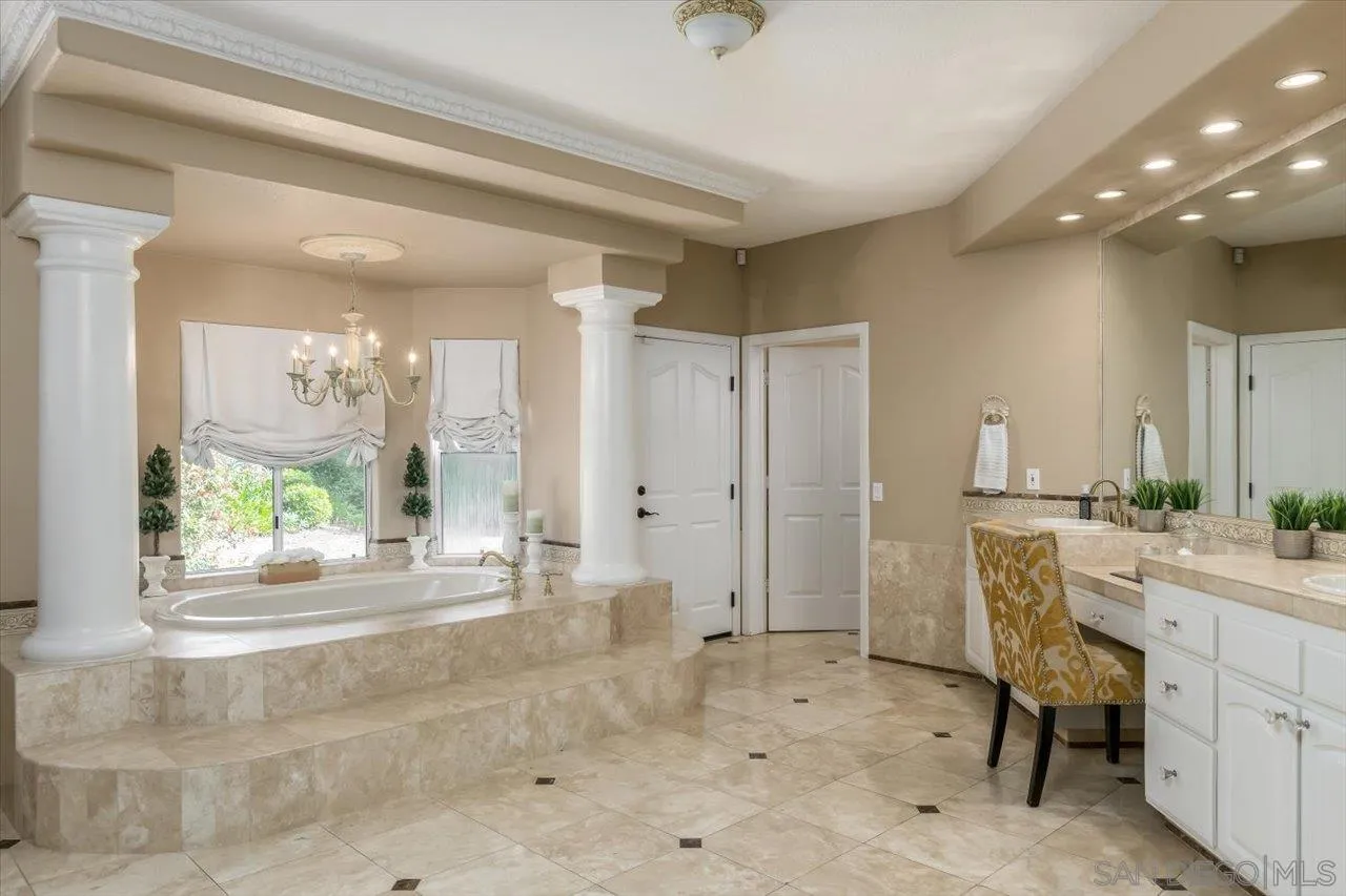 16348 Country Day Road Poway, CA 92064 - Photo 17 of 38 a bathroom with a sink a vanity and a mirror