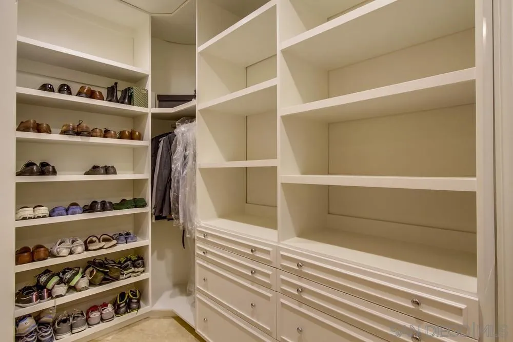 16348 Country Day Road Poway, CA 92064 - Photo 20 of 38 a view of walk in closet with empty racks