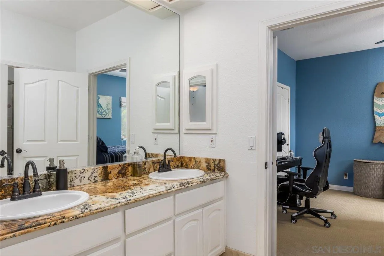 16348 Country Day Road Poway, CA 92064 - Photo 27 of 38 a bathroom with a granite countertop sink and a mirror