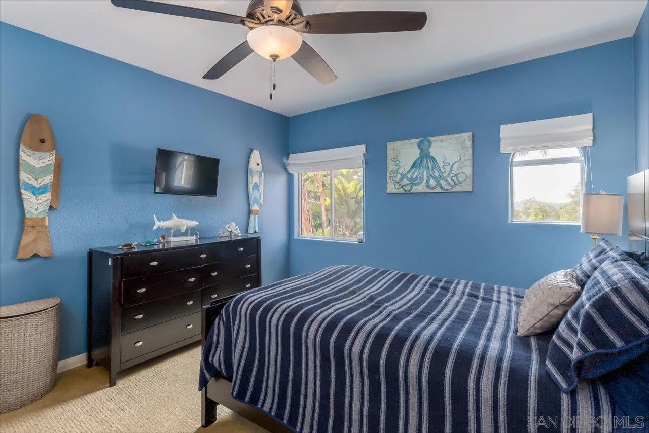 16348 Country Day Road Poway, CA 92064 - Photo 28 of 38 a bedroom with a bed and a flat screen tv