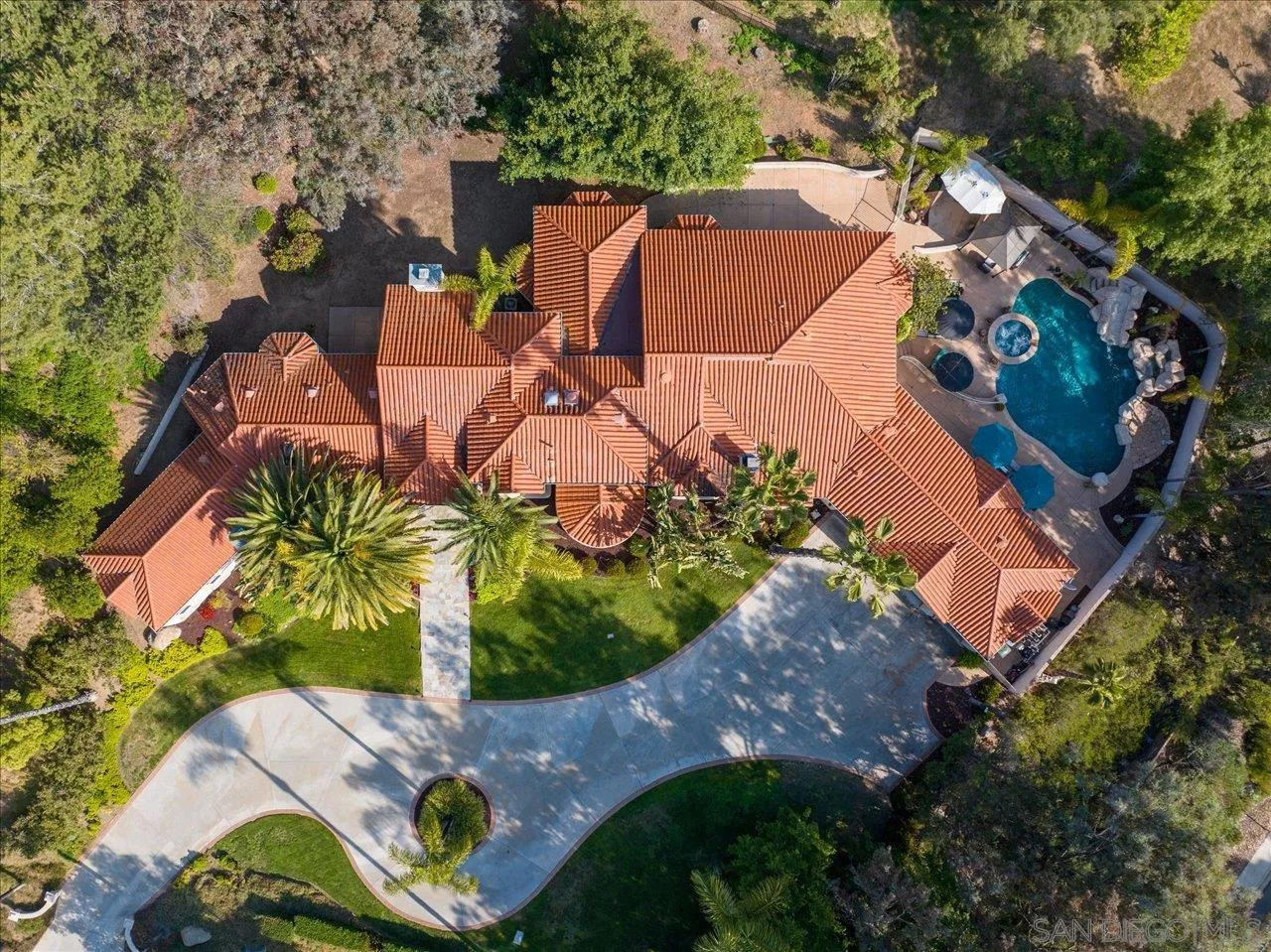 16348 Country Day Road Poway, CA 92064 - Photo 35 of 38 an aerial view of a house with a garden and trees