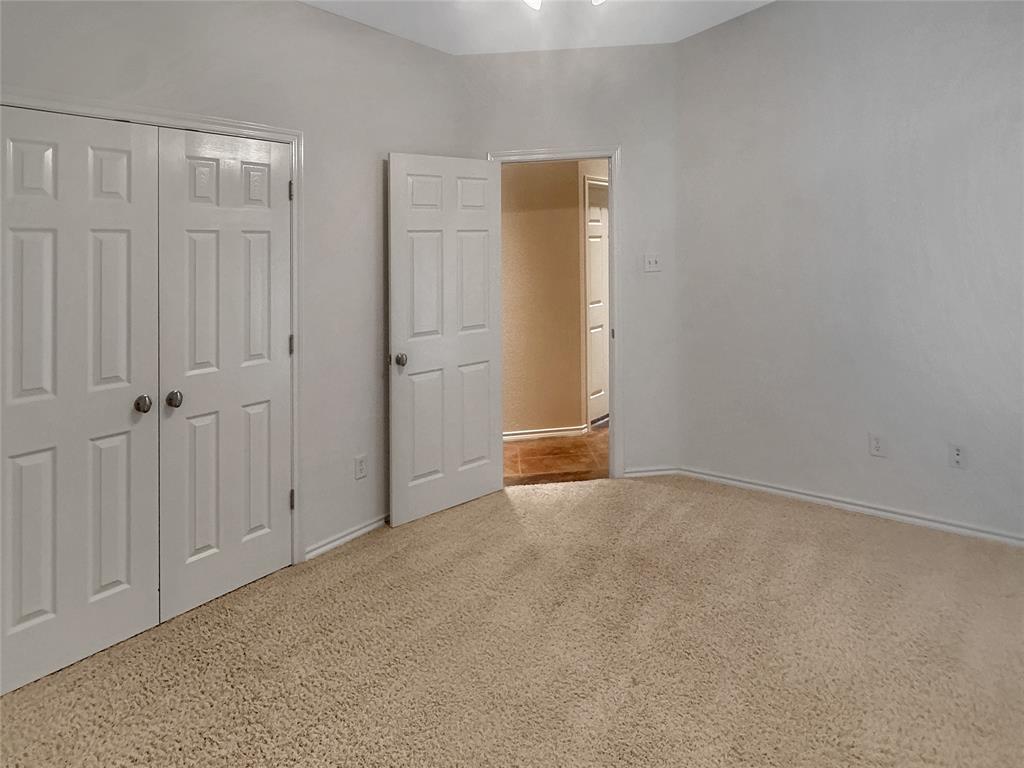 10717 Greenview Court Benbrook, TX 76126 - Photo 13 of 36 an empty room with windows