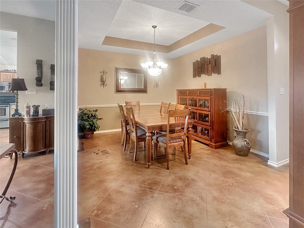 10717 Greenview Court Benbrook, TX 76126 - Photo 2 of 36 a view of a dining room with furniture