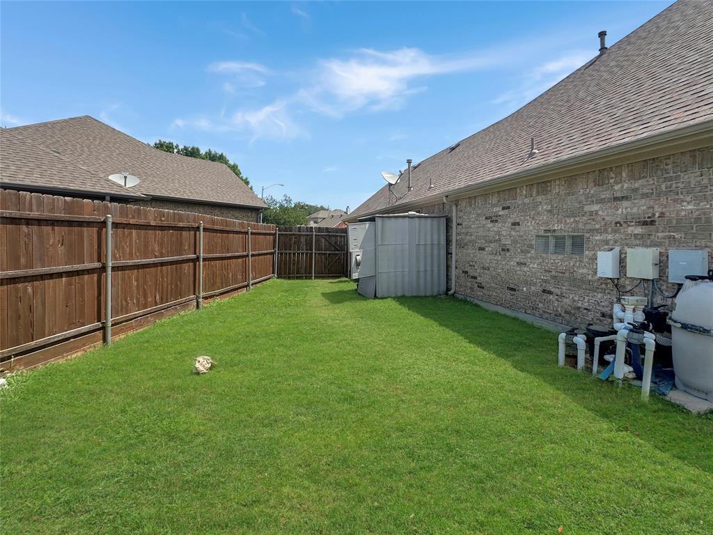 10717 Greenview Court Benbrook, TX 76126 - Photo 26 of 36 a view of a backyard with a garden
