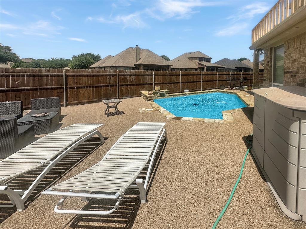 10717 Greenview Court Benbrook, TX 76126 - Photo 27 of 36 swimming pool view with a seating space