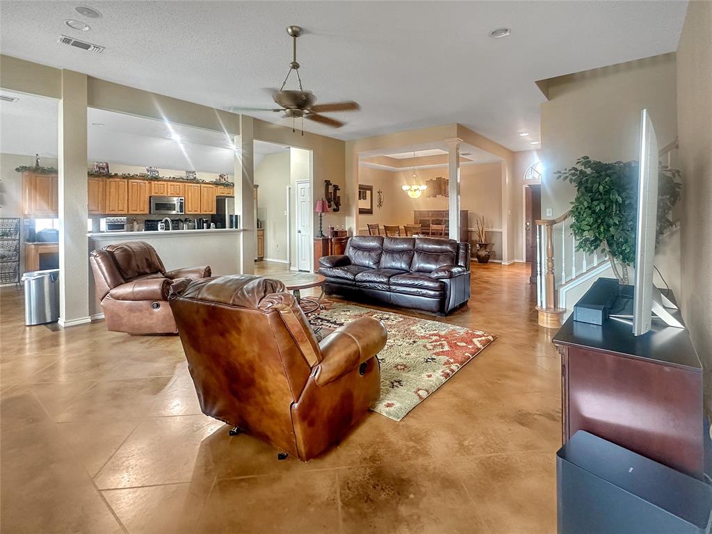 10717 Greenview Court Benbrook, TX 76126 - Photo 3 of 36 a living room with furniture and a large window