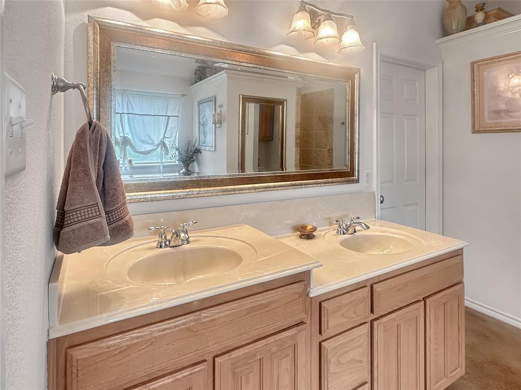 10717 Greenview Court Benbrook, TX 76126 - Photo 8 of 36 a bathroom with a sink and a mirror