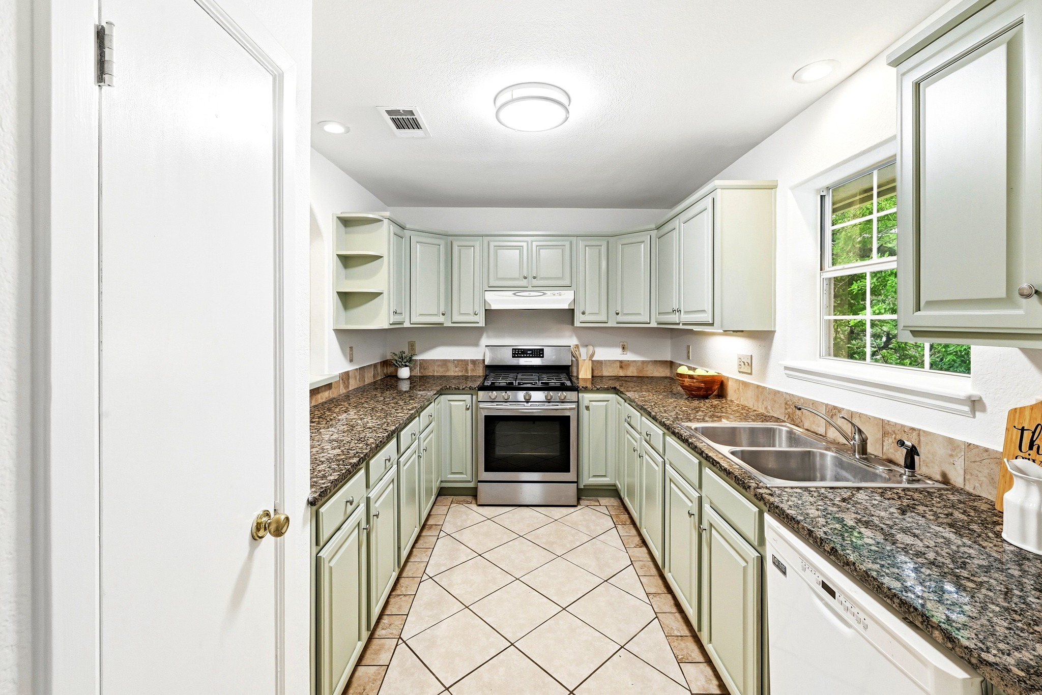 2405 Bahama Road Austin, TX 78733 - Photo 18 of 39 There's plenty of cabinet storage and prep space in the kitchen.