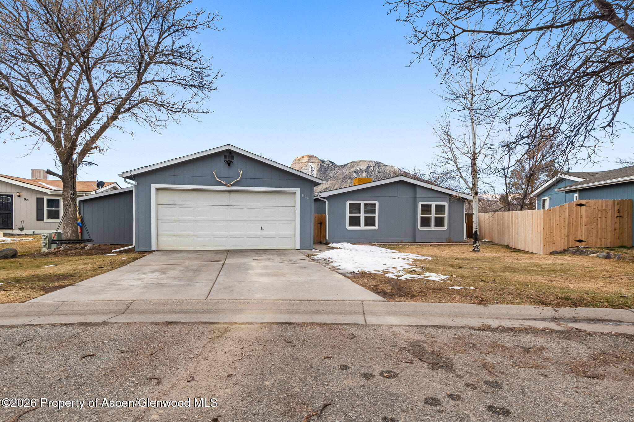 106 Cedar Circle Parachute, CO 81635 - Photo 1 of 35 a front view of a house with a yard and garage