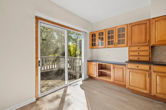 a kitchen with granite countertop a stove top oven