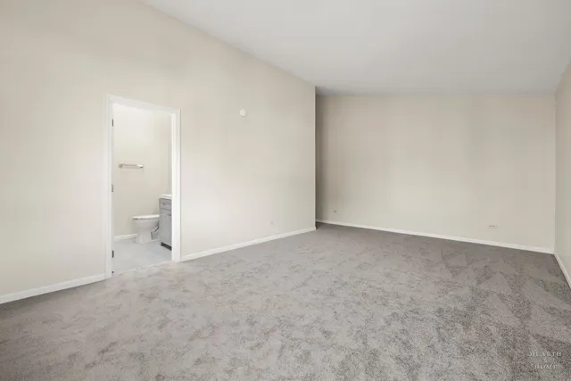 a view of an empty room and closet