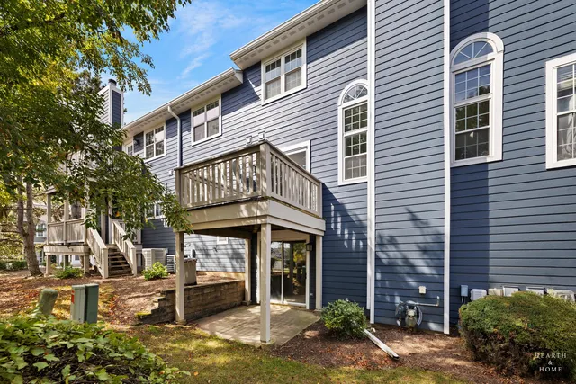 a view of a brick house with many windows