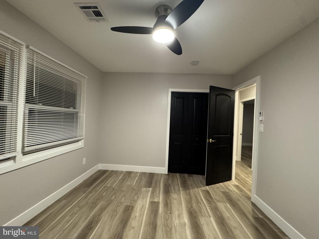 24 Pilgrim Lane Willingboro, NJ 08046 - Photo 11 of 31 a view of an empty room with wooden floor and a window