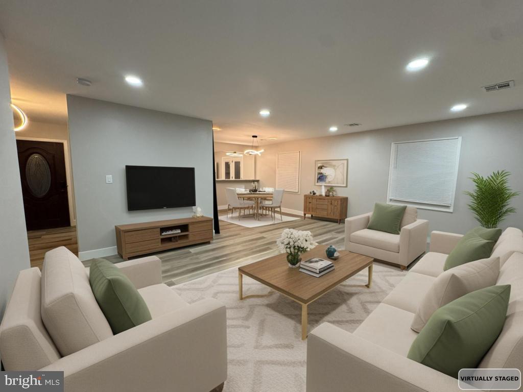 24 Pilgrim Lane Willingboro, NJ 08046 - Photo 17 of 31 a living room with furniture and a flat screen tv