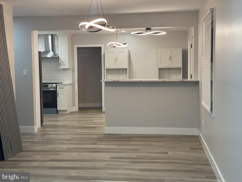 24 Pilgrim Lane Willingboro, NJ 08046 - Photo 20 of 31 a view of a kitchen with a refrigerator and a stove top oven