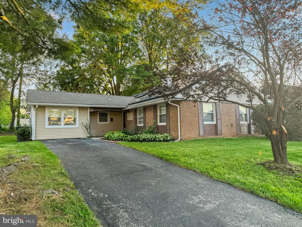 24 Pilgrim Lane Willingboro, NJ 08046 - Photo 2 of 31 a front view of a house with a yard and a garage