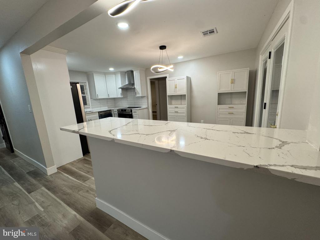 24 Pilgrim Lane Willingboro, NJ 08046 - Photo 23 of 31 a large bathroom with a large mirror vanity and a sink
