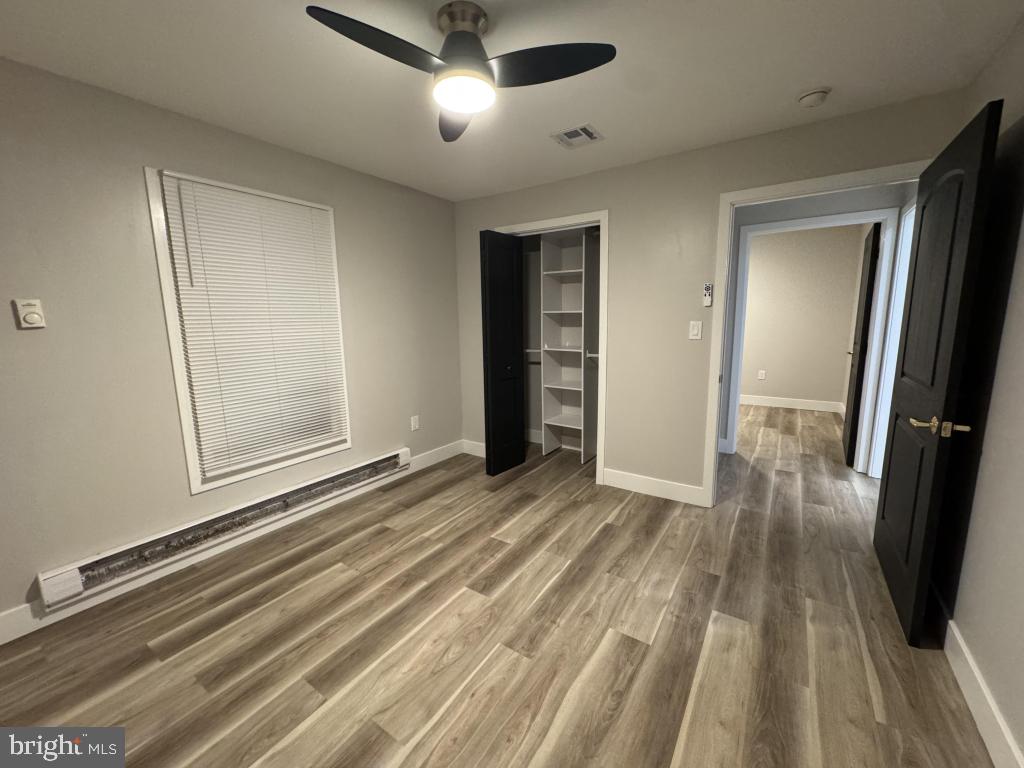 24 Pilgrim Lane Willingboro, NJ 08046 - Photo 27 of 31 a view of a room with wooden floor and staircase