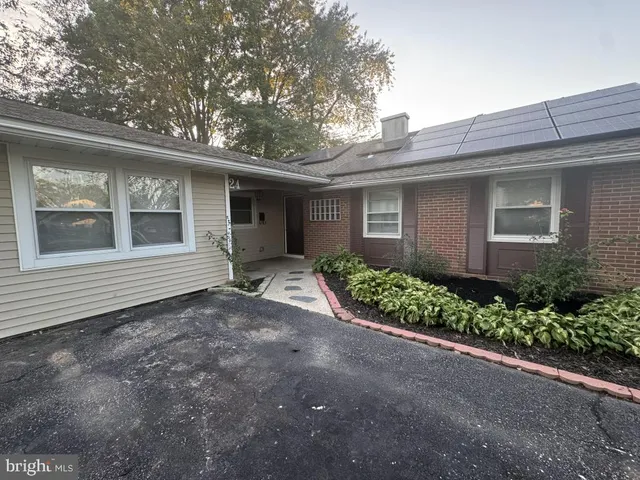 a view of a house with a small yard