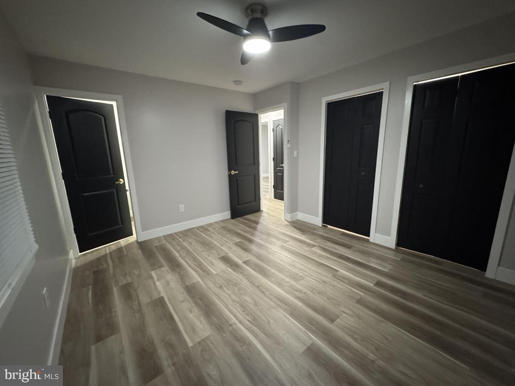 24 Pilgrim Lane Willingboro, NJ 08046 - Photo 5 of 31 a view of an empty room with wooden floor and a ceiling fan