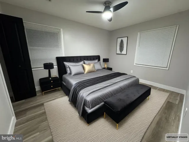 a bedroom with a bed lamp and a fireplace