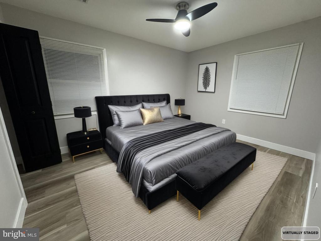 24 Pilgrim Lane Willingboro, NJ 08046 - Photo 8 of 31 a bedroom with a bed lamp and a fireplace