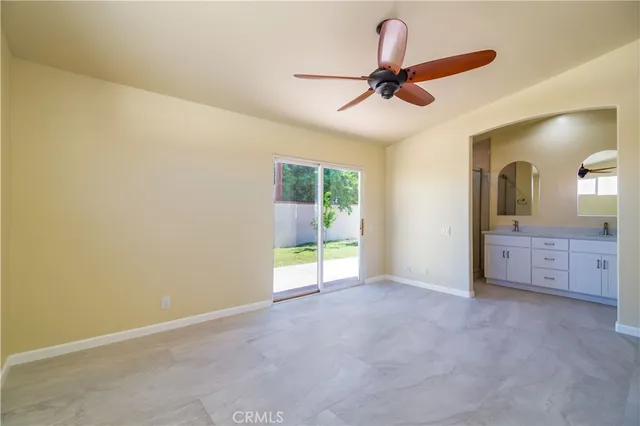 a bathroom with a double vanity sink a toilet and a mirror