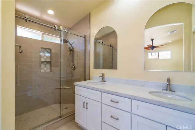 a view of an empty room with a fireplace and a window