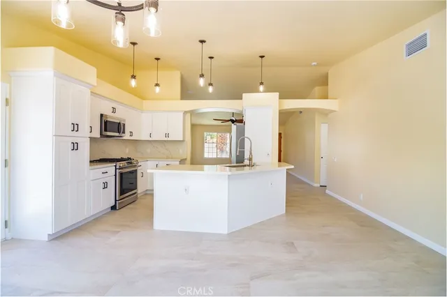 a view of a kitchen and a window