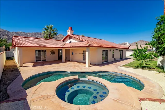 a view of a house with a swimming pool