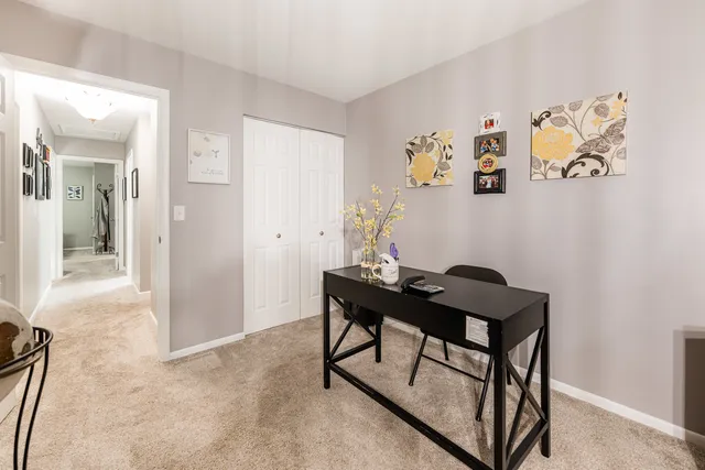 a view of a workspace with furniture