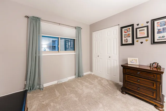 a view of room with painting on the wall