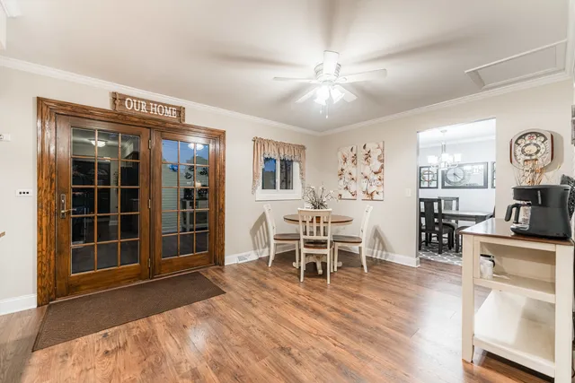 a view of a livingroom with furniture and a flat screen tv