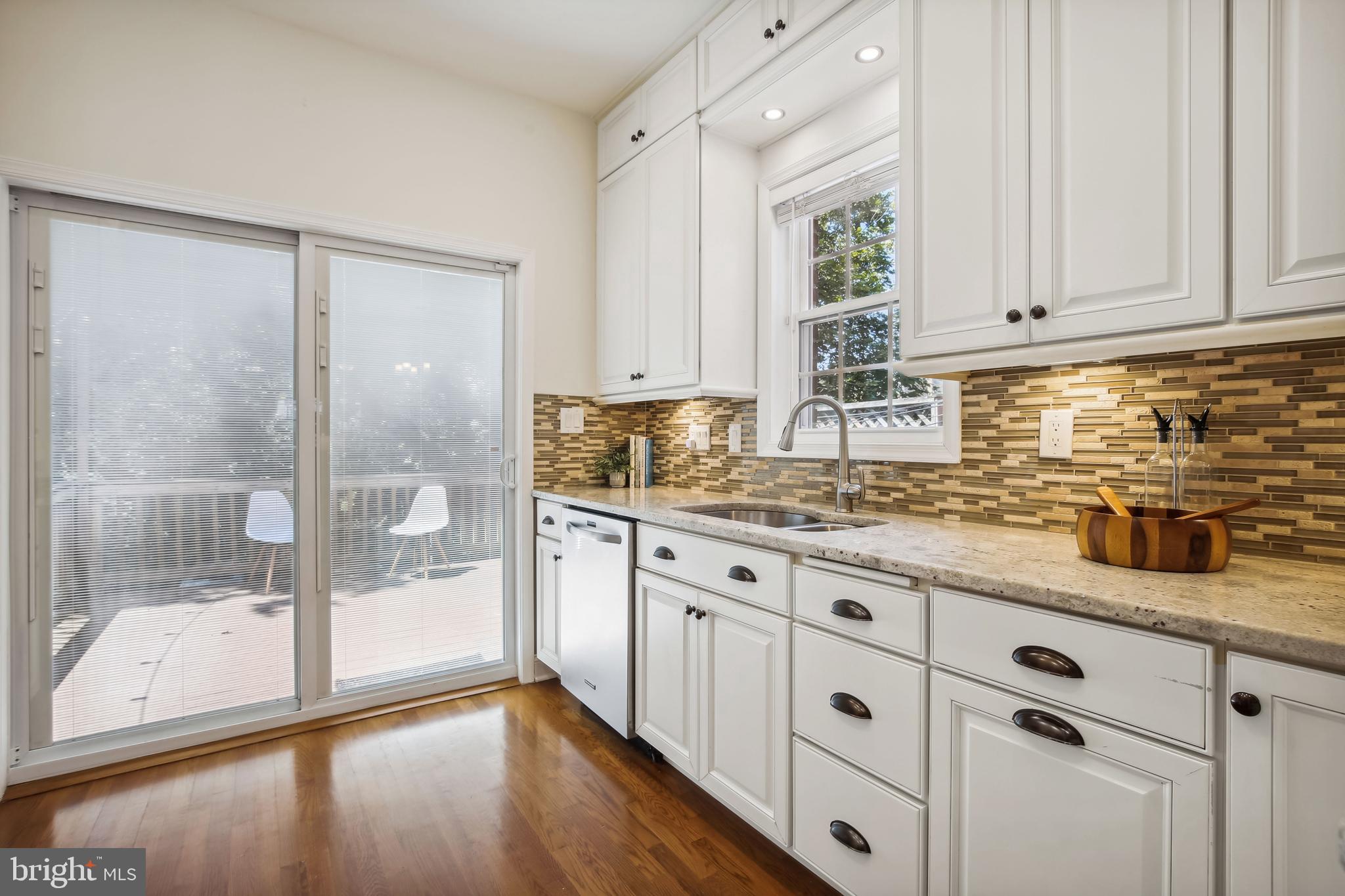 1770 Hobart Street Northwest Washington, DC 20009 - Photo 16 of 44 Kitchen w/ granite & variegated tile backsplash
