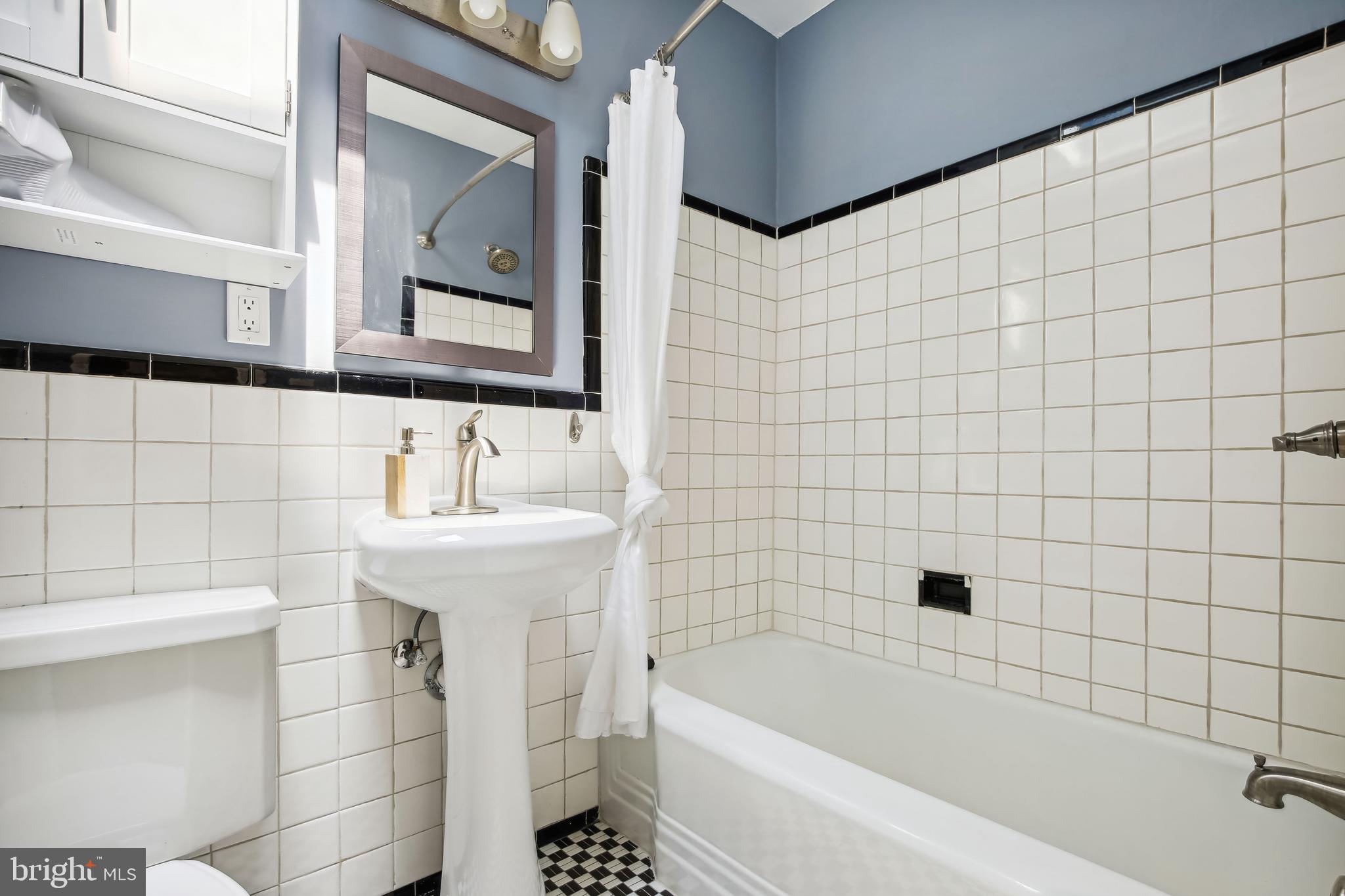 1770 Hobart Street Northwest Washington, DC 20009 - Photo 30 of 44 Hall Bath w/tub - classic tile & skylight
