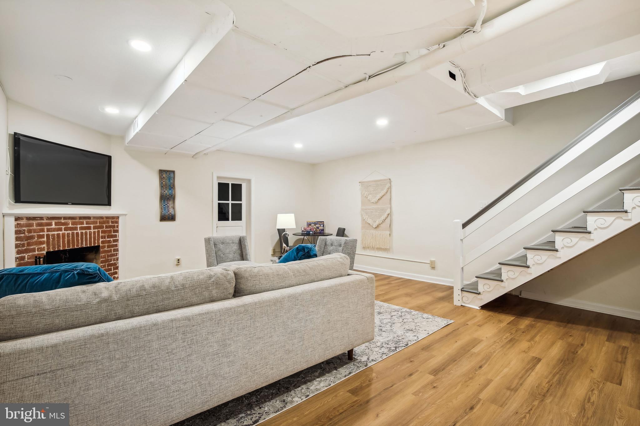 1770 Hobart Street Northwest Washington, DC 20009 - Photo 32 of 44 Rec Room w/new LVP floor & recessed LED lighting