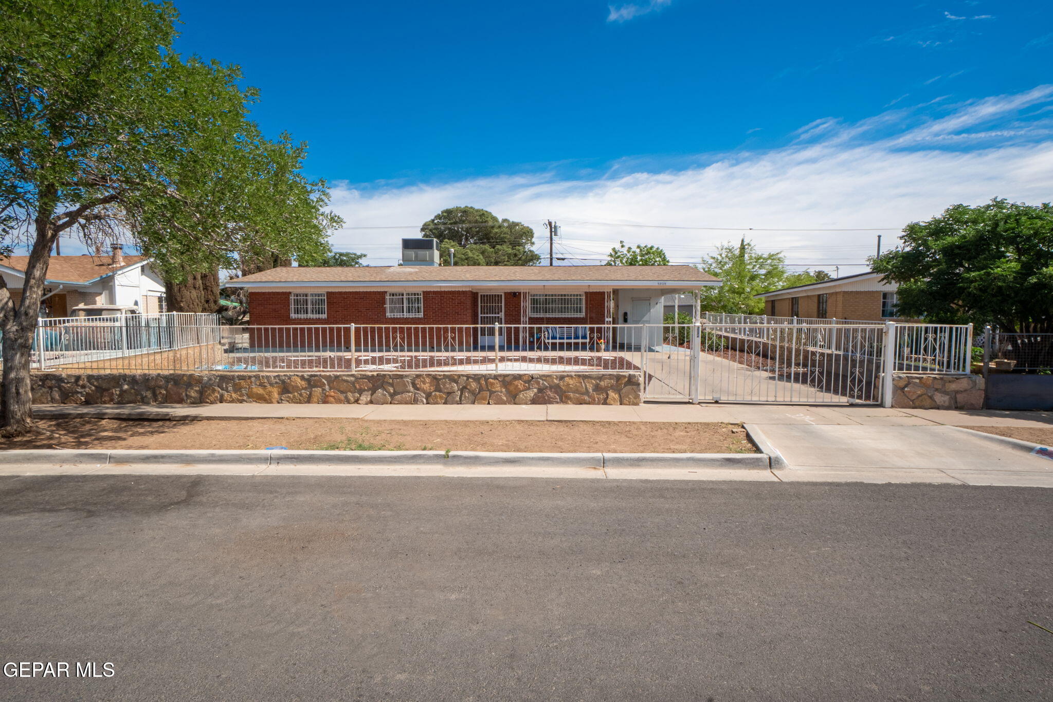 5025 Rutherford Drive El Paso, TX 79924 - Photo 1 of 1 front view of a house with a swimming pool