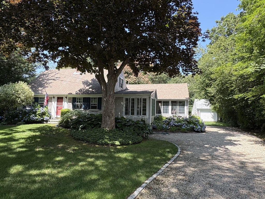 68 Gorham Road Harwich, MA 02646 - Photo 1 of 33 a front view of a house with a garden