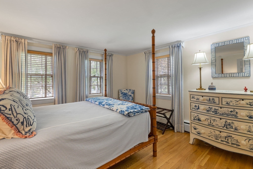 68 Gorham Road Harwich, MA 02646 - Photo 20 of 33 a spacious bedroom with a bed a dresser and a window