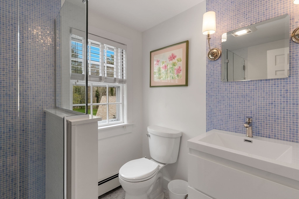 68 Gorham Road Harwich, MA 02646 - Photo 26 of 33 a white toilet sitting next to a bathroom sink