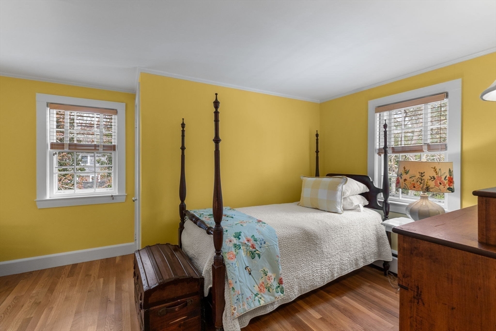 68 Gorham Road Harwich, MA 02646 - Photo 27 of 33 a bedroom with a bed and wooden floor