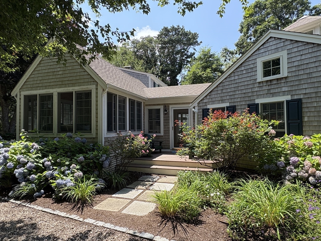 68 Gorham Road Harwich, MA 02646 - Photo 3 of 33 a front view of a house with a yard