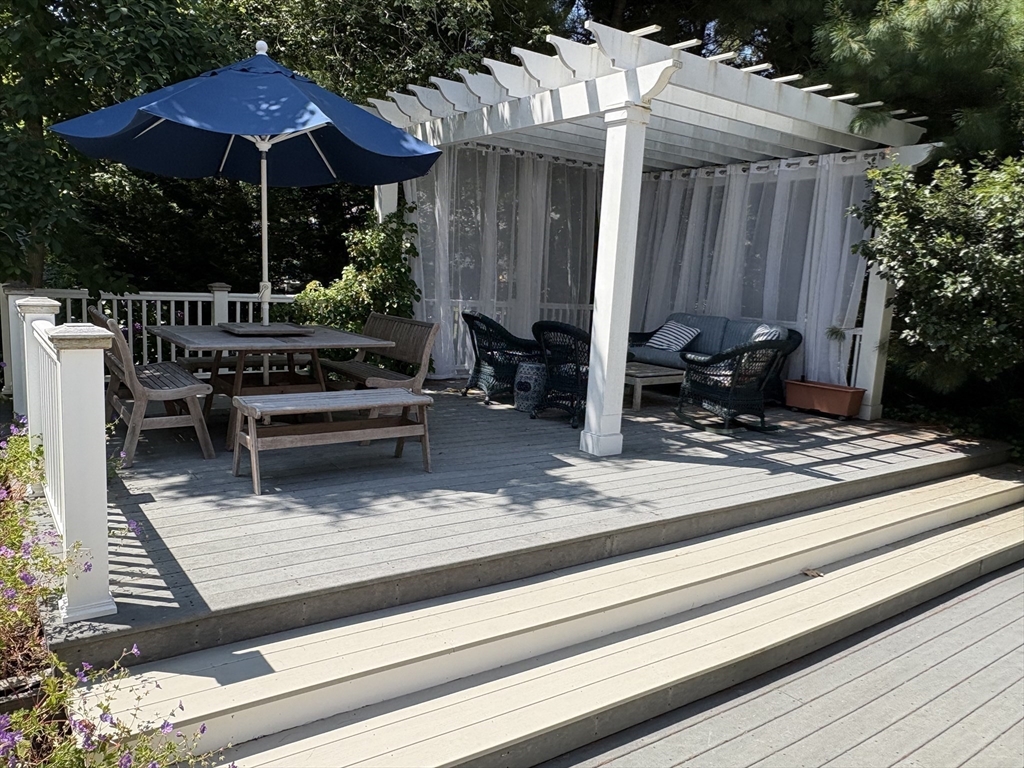 68 Gorham Road Harwich, MA 02646 - Photo 31 of 33 a view of backyard with seating space and wooden fence