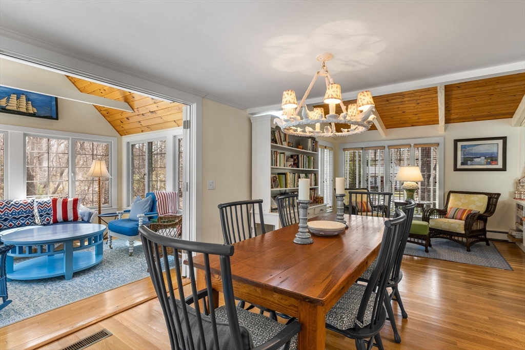 68 Gorham Road Harwich, MA 02646 - Photo 8 of 33 a view of a dining room with furniture wooden floor and chandelier