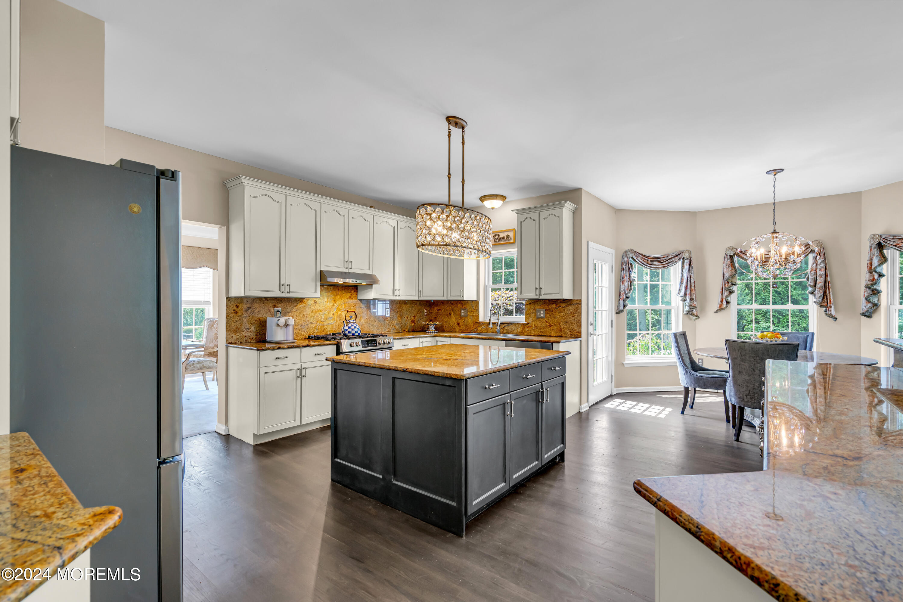 22 Cedar Knoll Road Jackson, NJ 08527 - Photo 18 of 76 a kitchen with stainless steel appliances granite countertop stove top oven and cabinets
